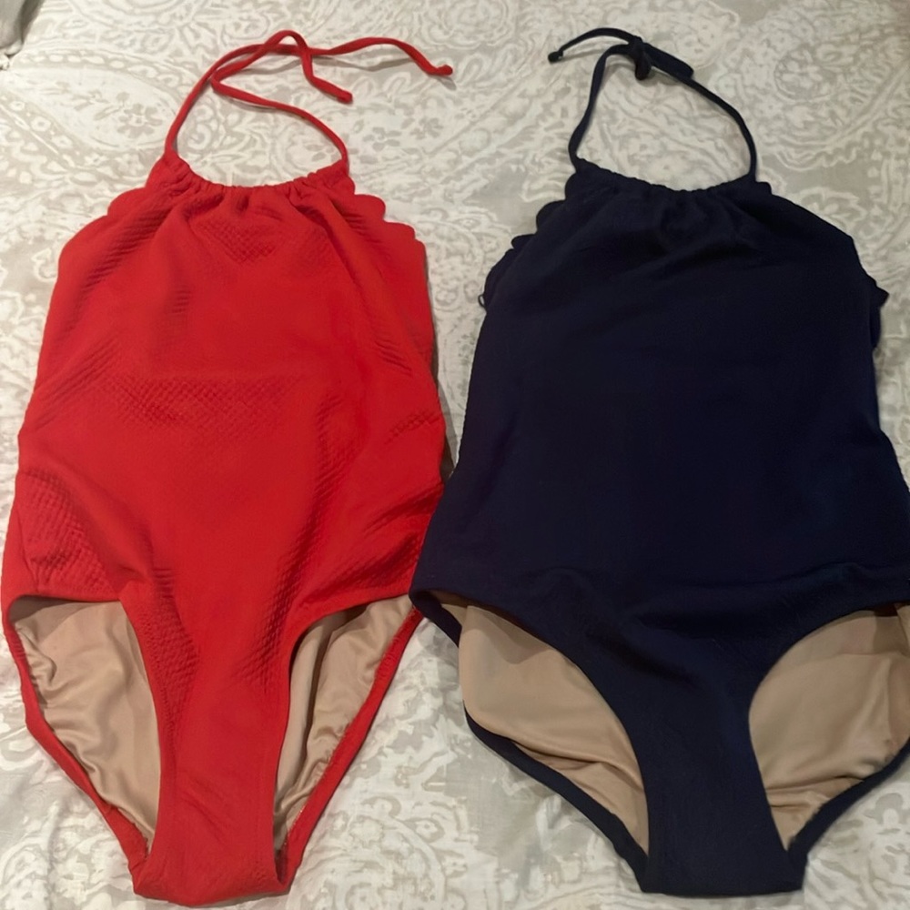 Red and blue one piece suits.